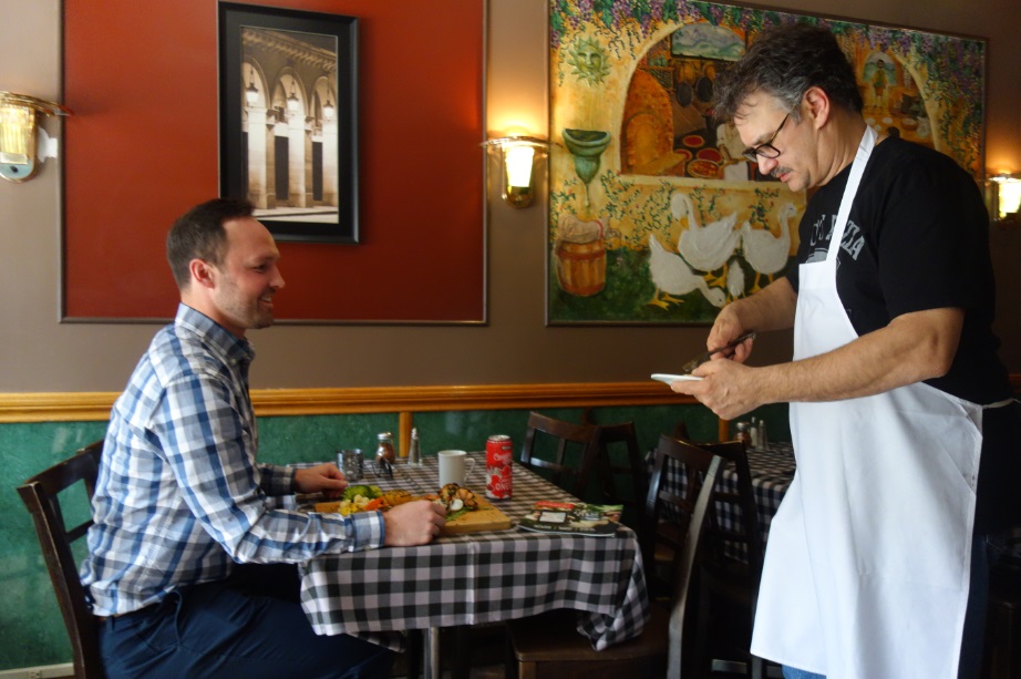 Matt Hunter from Dine Palace is served by Frank Horgan the owner of Amicos Pizza 