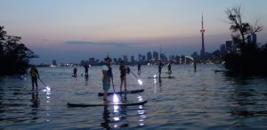 paddleboarding in Toronto harbour at night