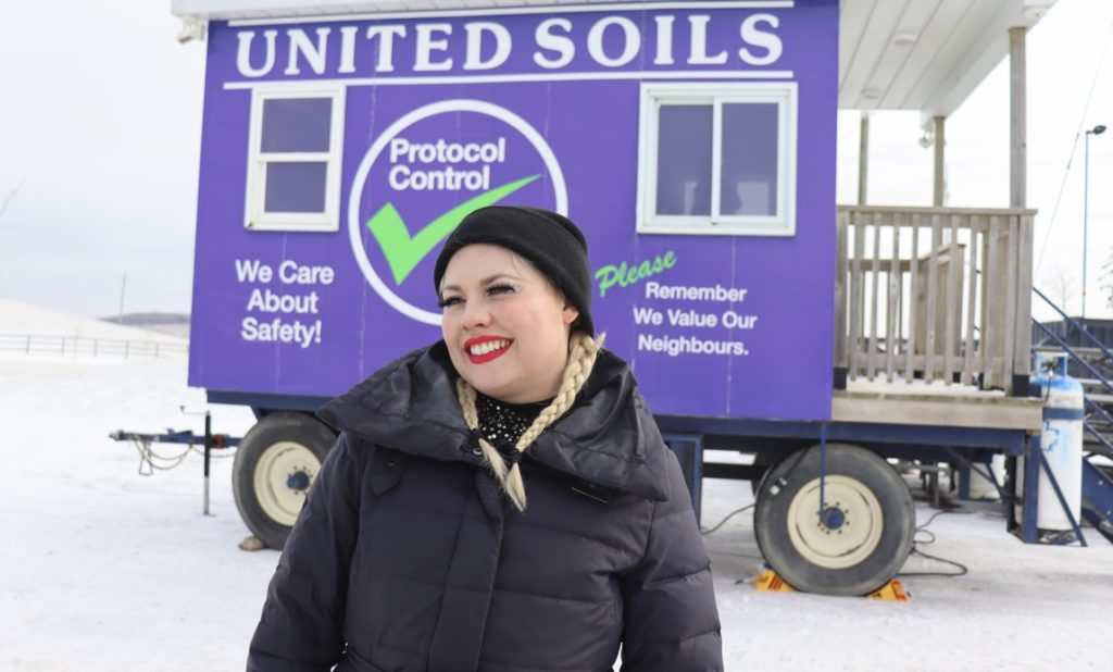 Maggie Haze beside the United Soils office trailer at the Tiny Seedlings winter festival in Stouffville.